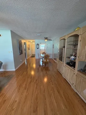a view of a living room and hardwood floor