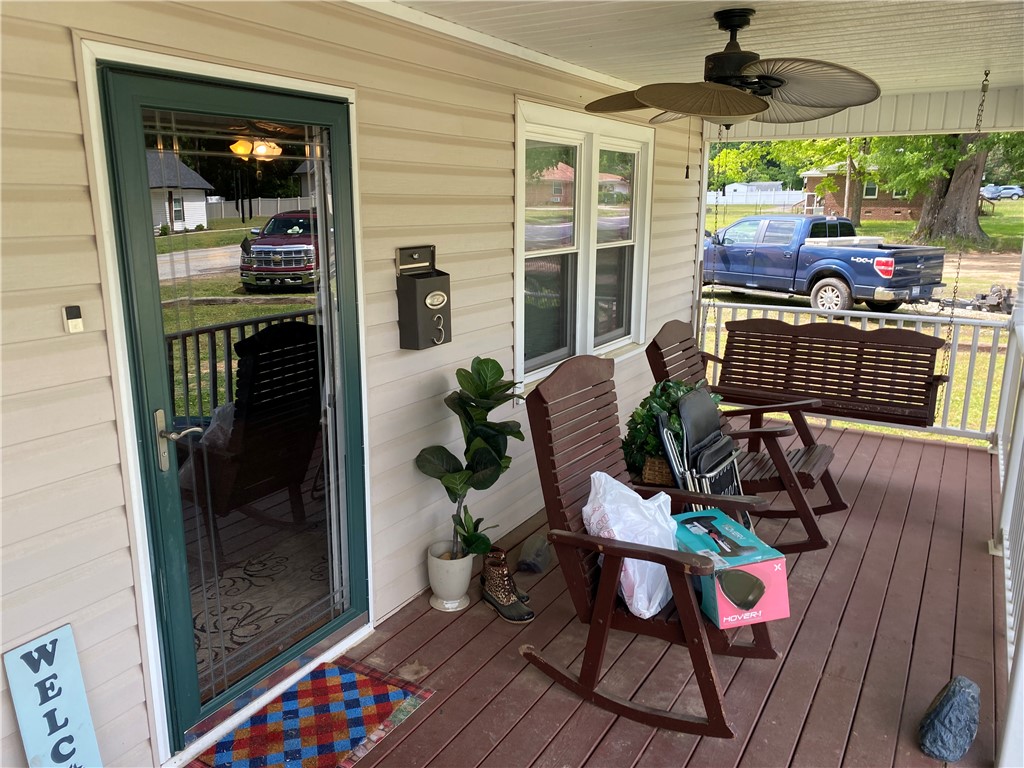 3 Heyward Avenue Honea Path, SC 29654 - Photo 4 of 35 This inviting front porch offers a welcoming entry with ample space for relaxation.