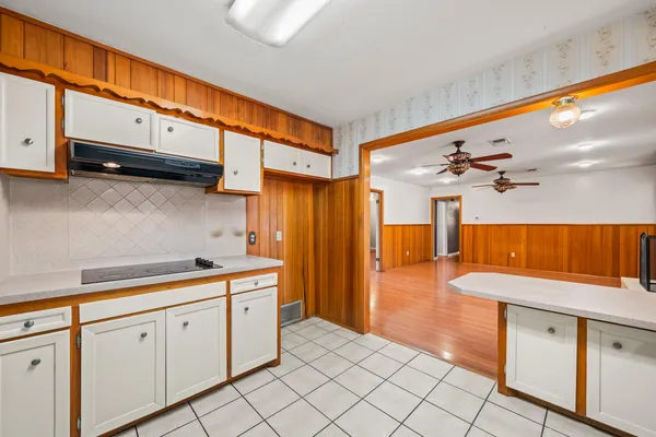 a kitchen with stainless steel appliances granite countertop a sink and cabinets