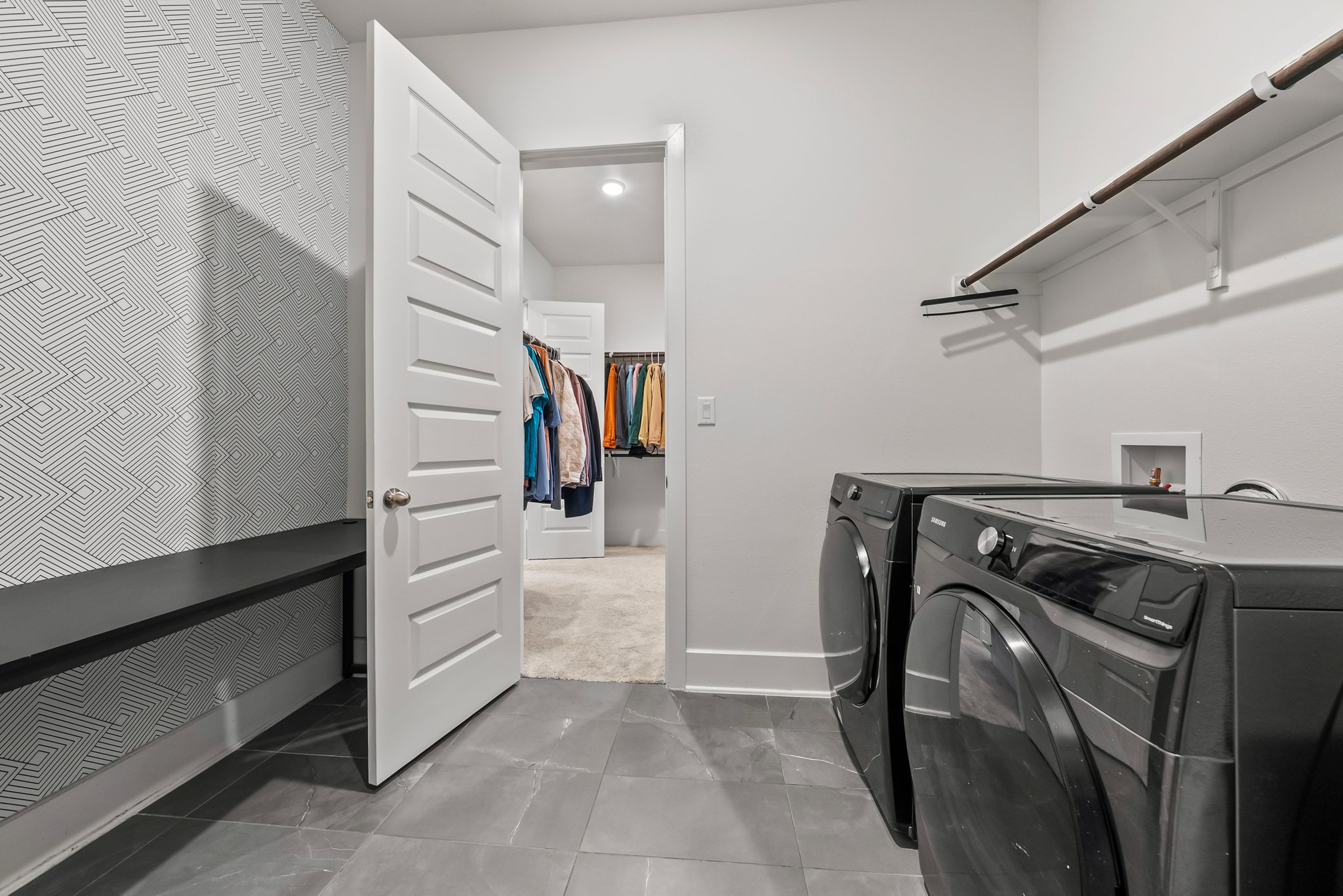 124 Low River Lane Georgetown, TX 78628 - Photo 22 of 38 a view of walk in closet with clothes and shoes