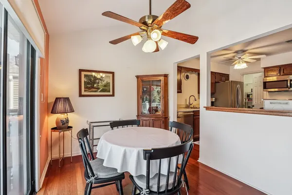 a view of a dining room with furniture and wooden floor