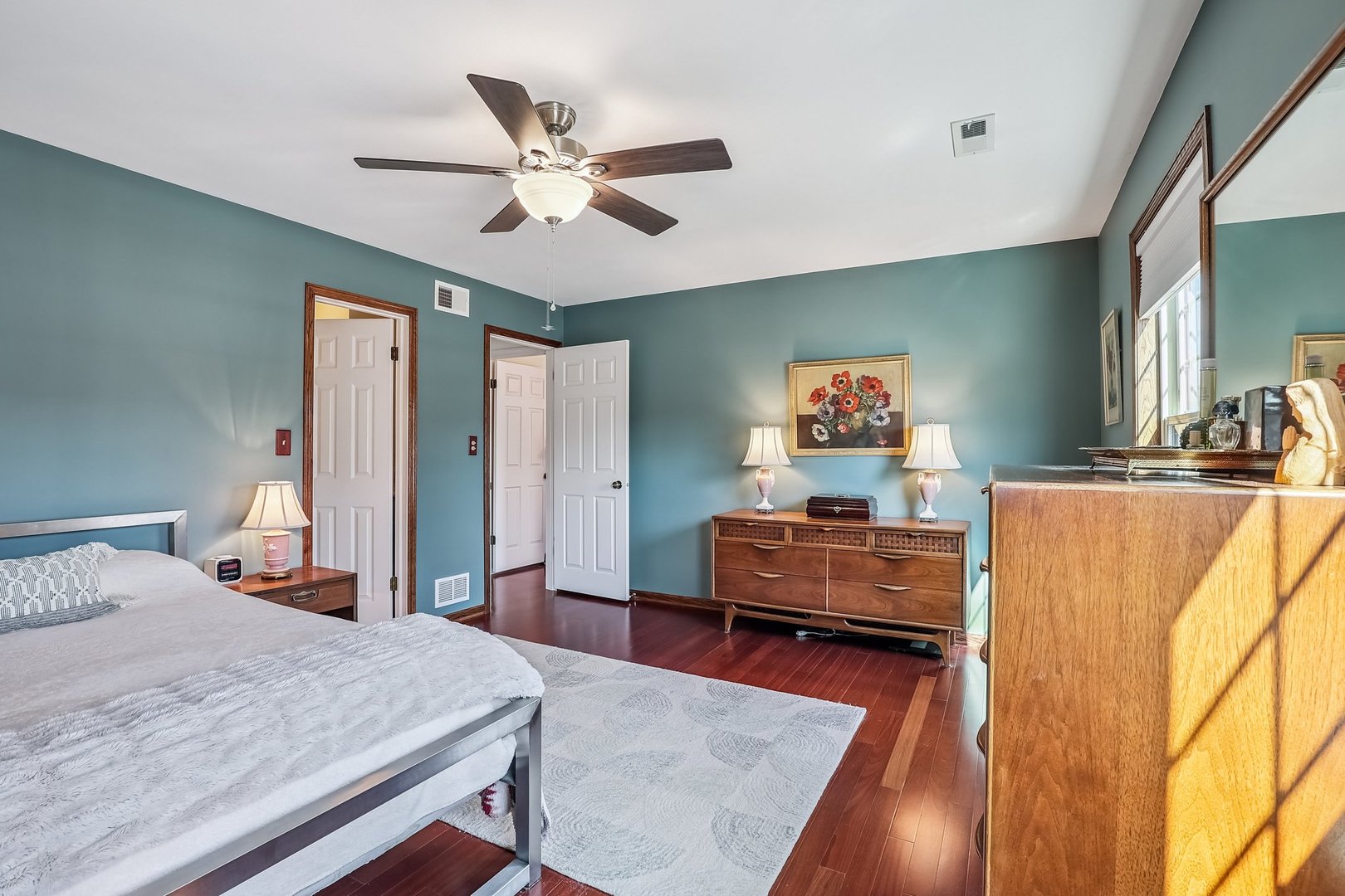 N150 Windermere Road, Unit 1306 Winfield, IL 60190 - Photo 8 of 11 a bedroom with a bed and wooden floor