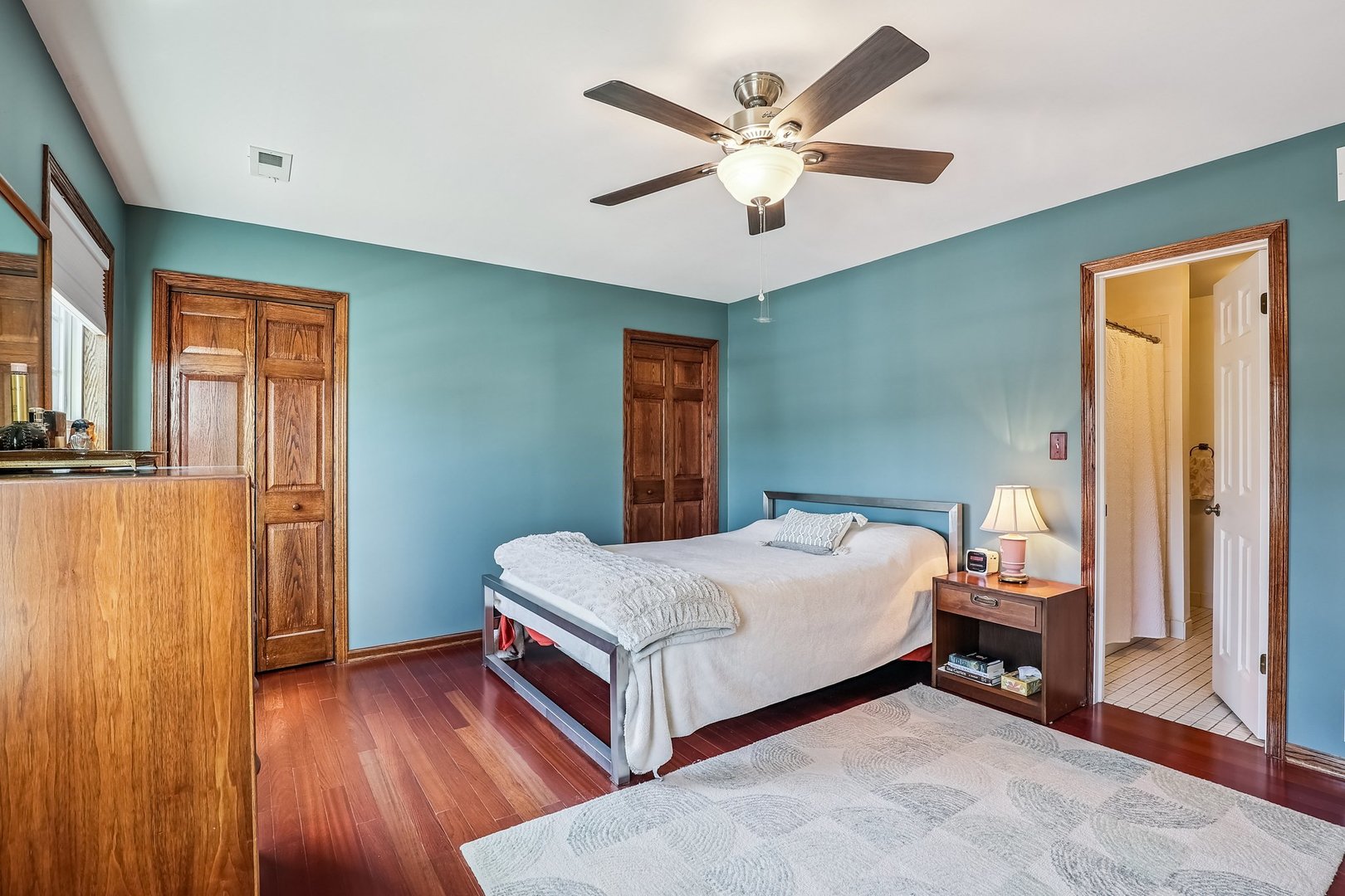 N150 Windermere Road, Unit 1306 Winfield, IL 60190 - Photo 9 of 11 a bedroom with a bed and a chandelier