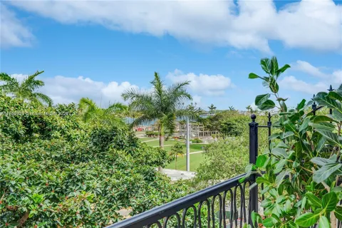 a view of a garden from a balcony
