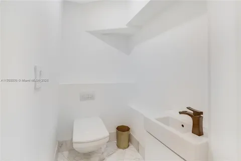a bathroom with a bathtub and toilet