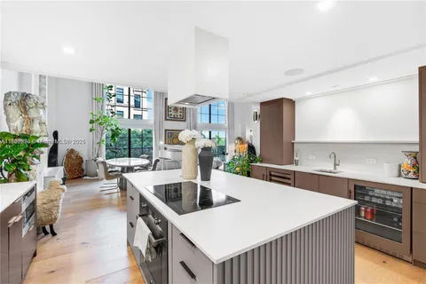 a kitchen with a stove a sink and a refrigerator