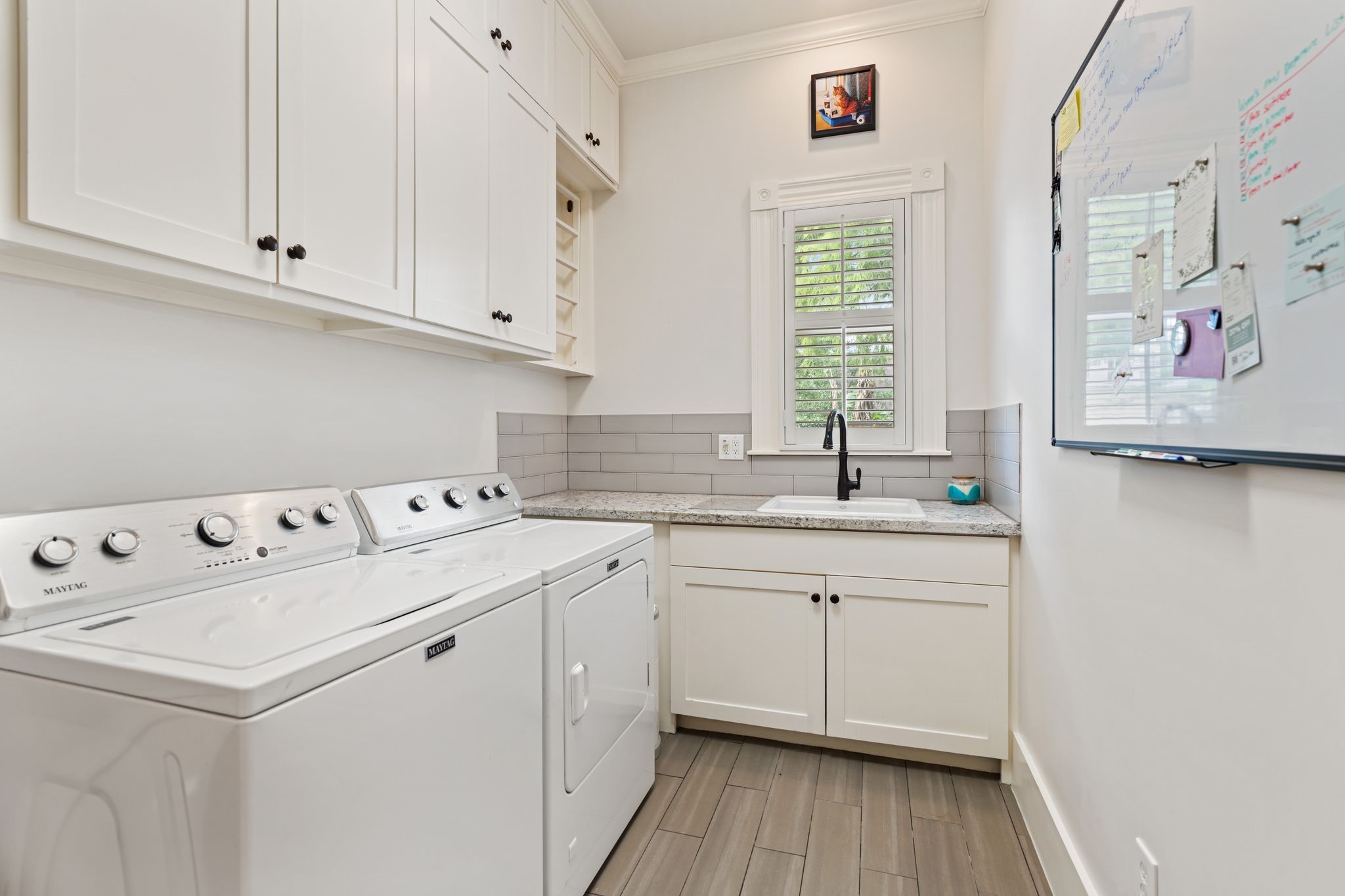 1421 Columbia Street Houston, TX 77008 - Photo 17 of 32 a kitchen with sink cabinets and window