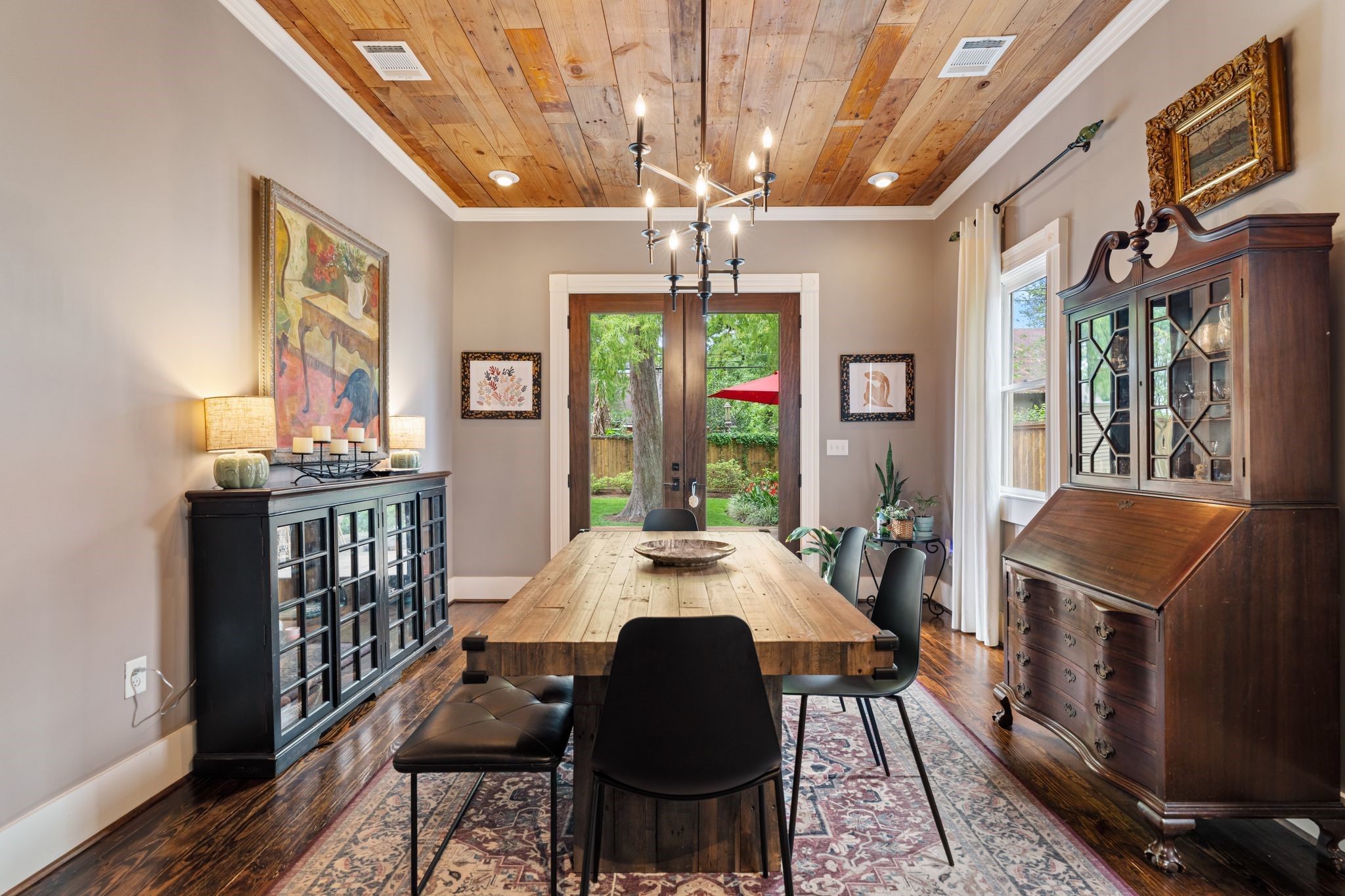 1421 Columbia Street Houston, TX 77008 - Photo 6 of 32 a view of a dining room with furniture a chandelier and wooden floor
