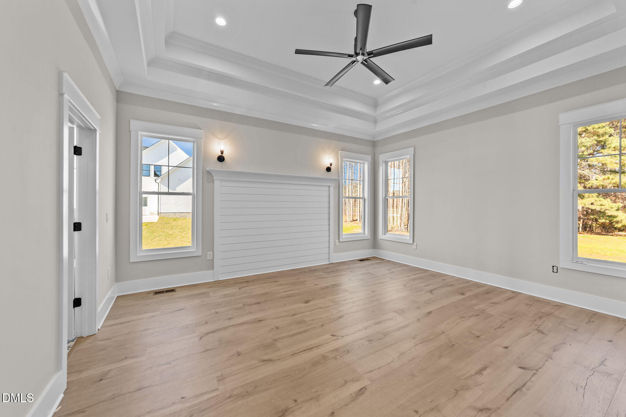 2568 Lassiter Road Four Oaks, NC 27524 - Photo 20 of 50 a view of an empty room with a window and wooden floor