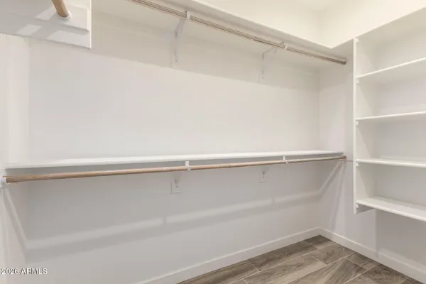 a view of an empty walk in closet
