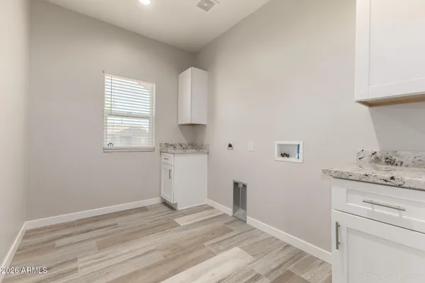 a room with a sink and a window