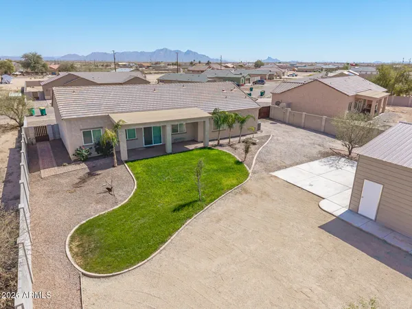 an aerial view of residential houses with outdoor space