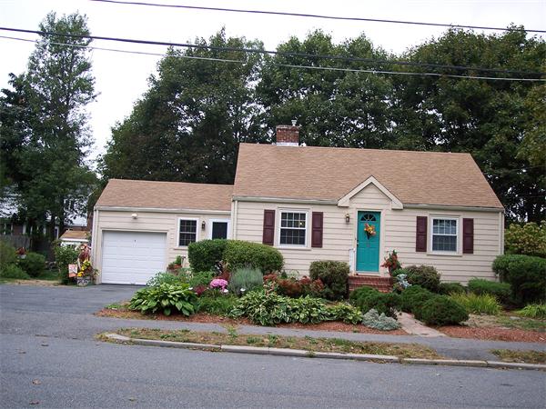 front view of house with a small yard