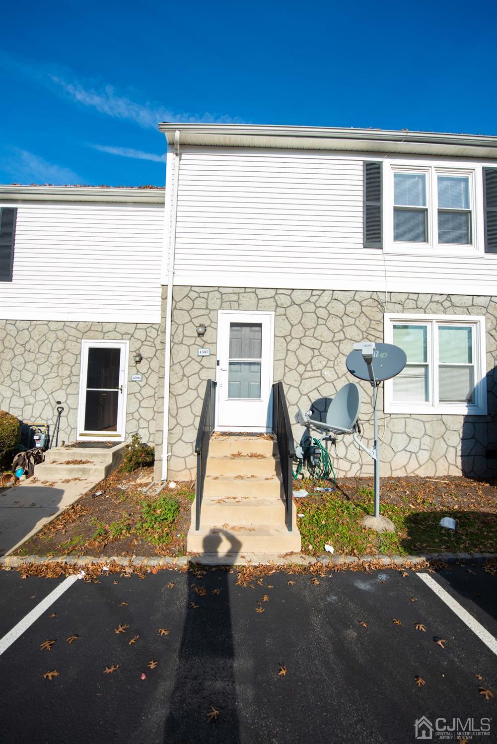 4507 Hana Road Edison, NJ 08817 - Photo 1 of 15 a front view of a house with sitting area