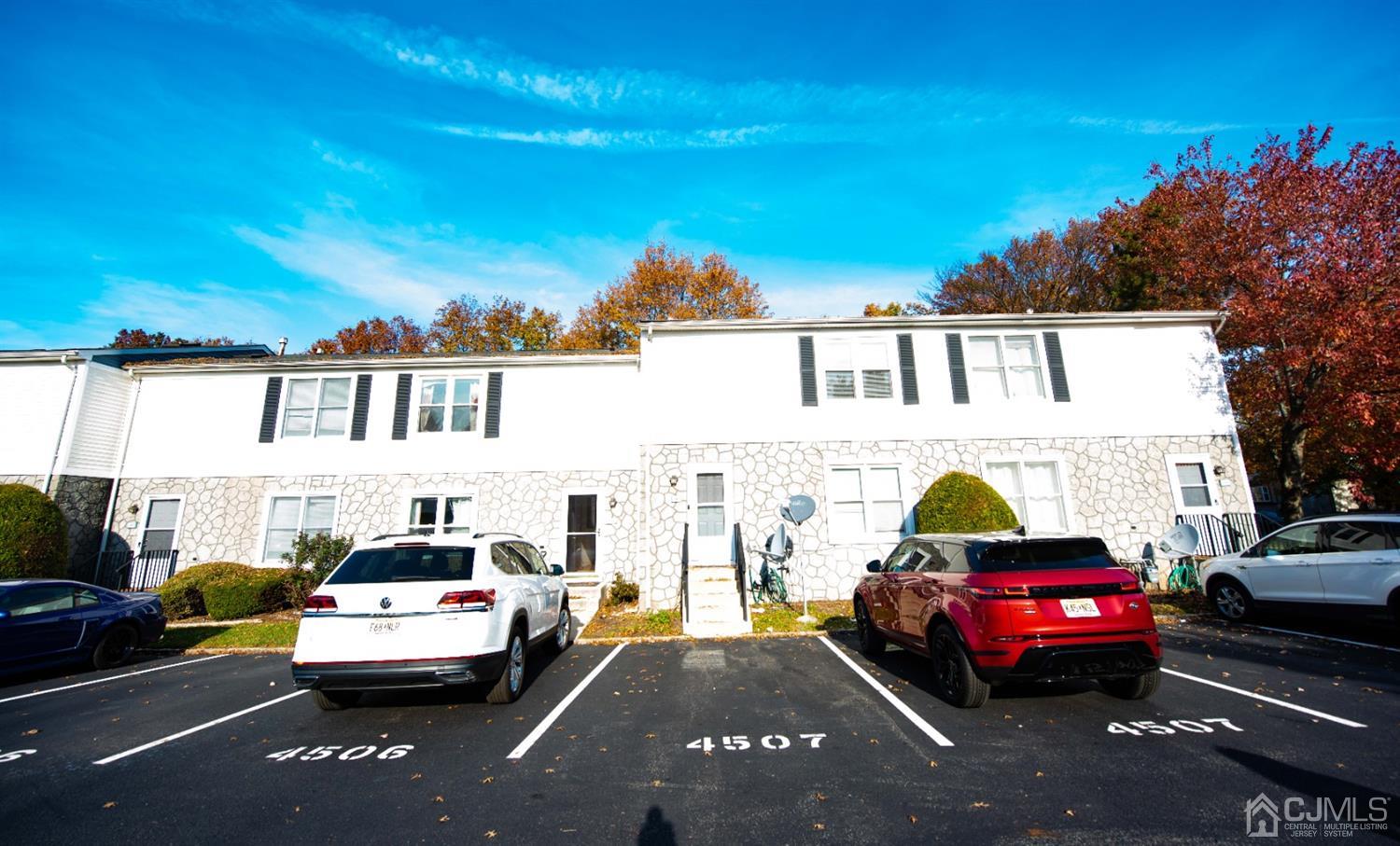 4507 Hana Road Edison, NJ 08817 - Photo 2 of 15 a view of a street that has parked cars