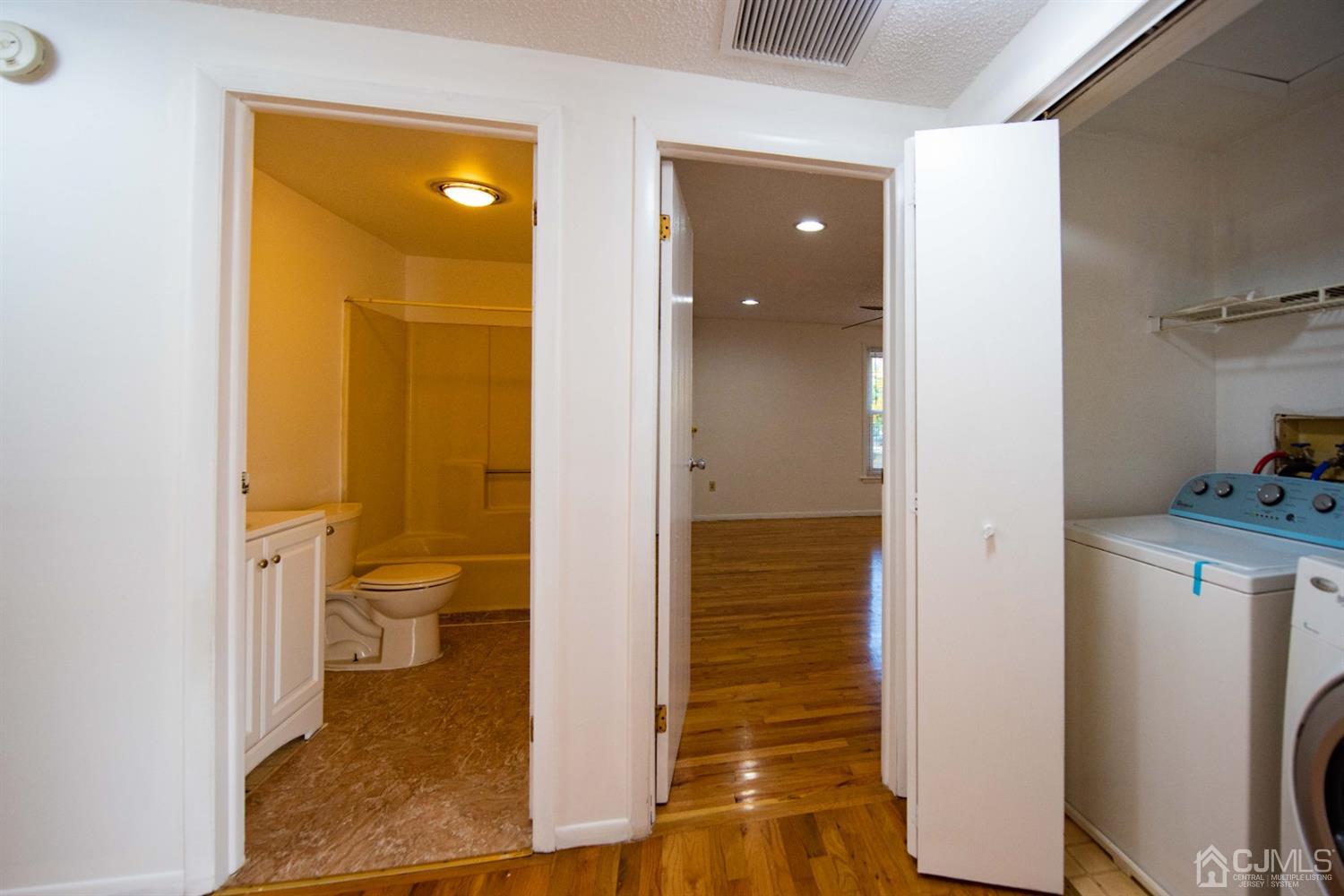 4507 Hana Road Edison, NJ 08817 - Photo 12 of 15 a bathroom with a sink and a toilet