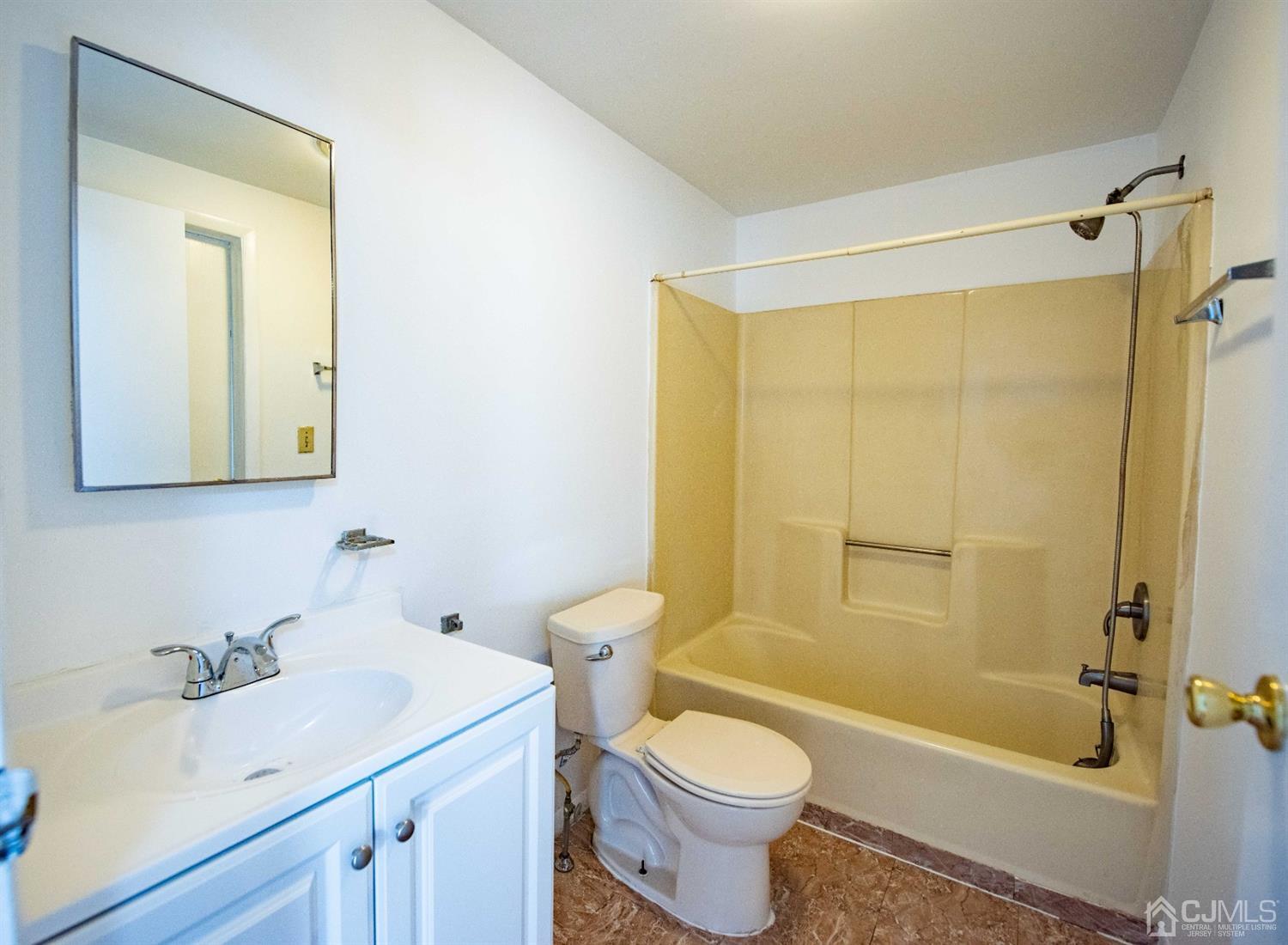 4507 Hana Road Edison, NJ 08817 - Photo 10 of 15 a bathroom with a sink toilet and shower