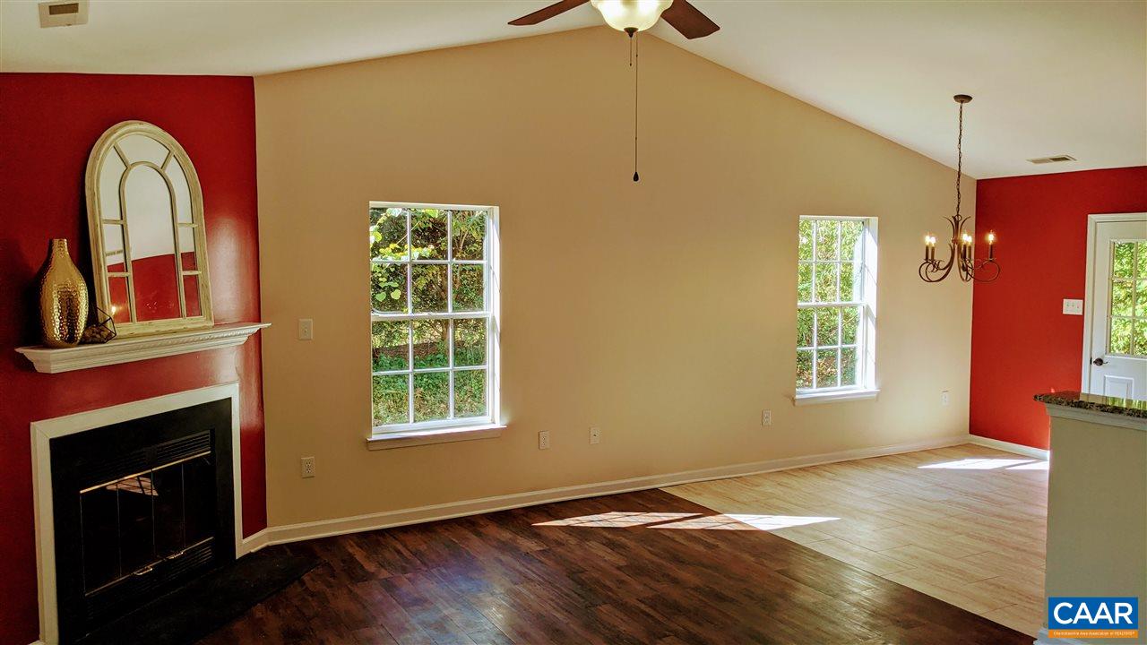 957 West Daffodil Road Ruckersville, VA 22968 - Photo 4 of 25 a view of a livingroom with wooden floor and a window