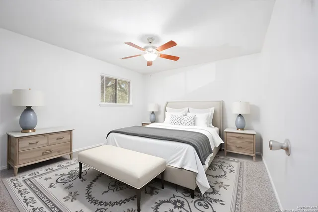 an empty room with closet and windows