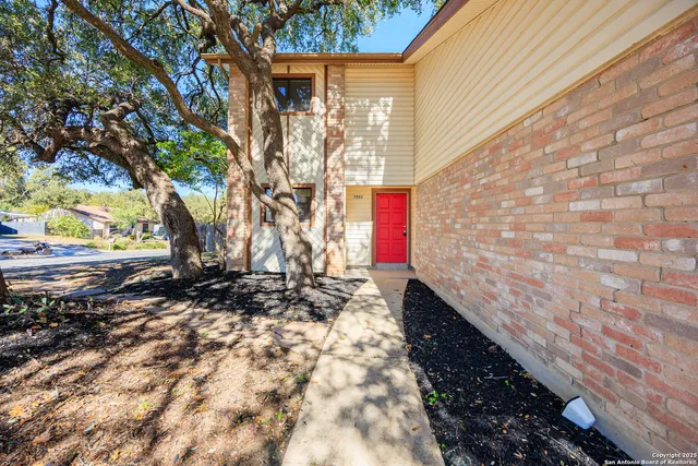 a backyard of a house with lots of green space