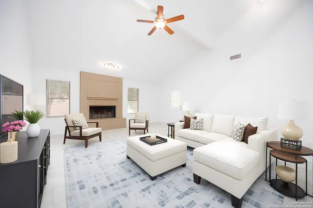 a living room with furniture and a fireplace