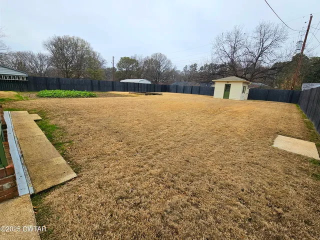 a view of swimming pool with a yard