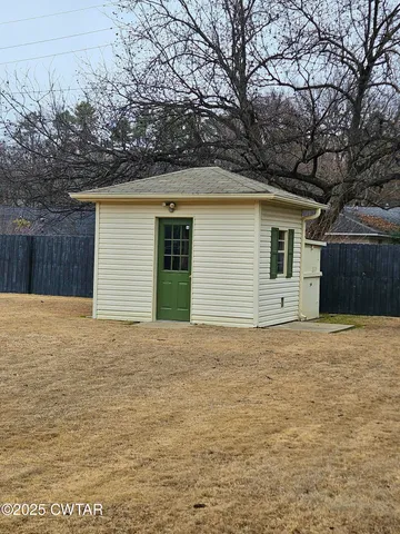 a house with trees in front of it
