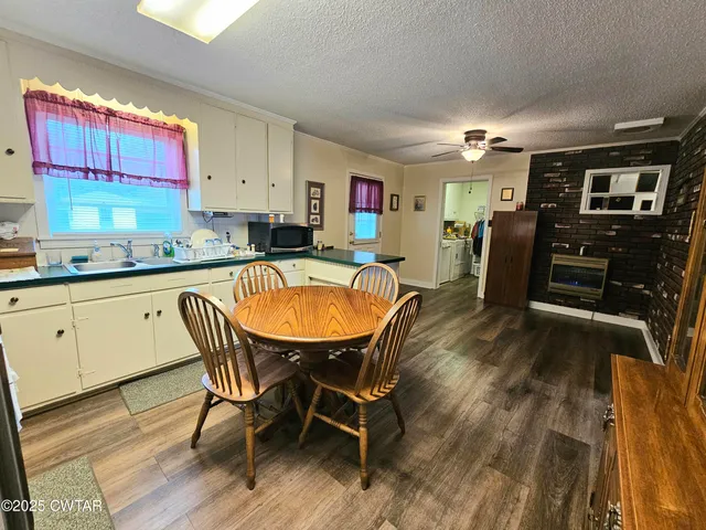 a dining room with furniture and wooden floor