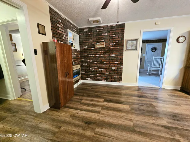 a view of an empty room with a fireplace