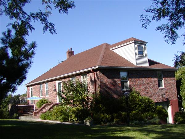 12 Shore Garden Road Hull, MA 02045 - Photo 1 of 22 a front view of a house with a garden