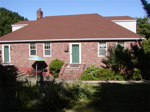 12 Shore Garden Road Hull, MA 02045 - Photo 16 of 22 a front view of a house with garden