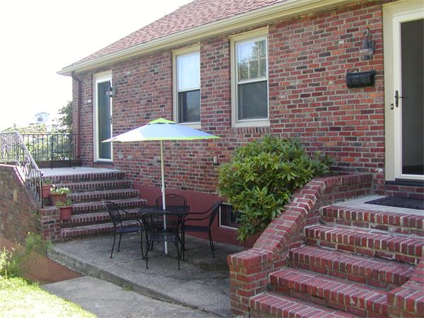 12 Shore Garden Road Hull, MA 02045 - Photo 18 of 22 a front view of a house with outdoor seating