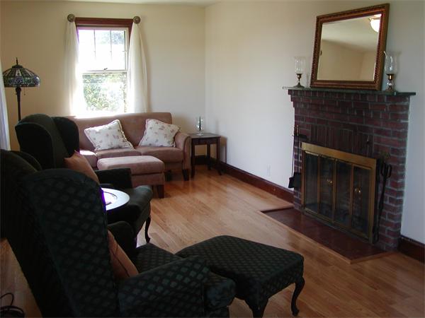12 Shore Garden Road Hull, MA 02045 - Photo 2 of 22 a living room with furniture and a fireplace