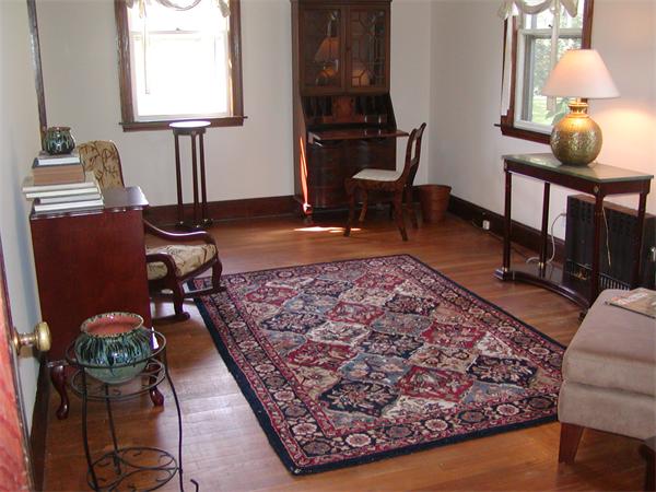 12 Shore Garden Road Hull, MA 02045 - Photo 3 of 22 a living room with furniture and a lamp