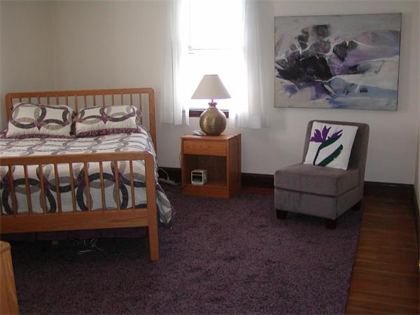 12 Shore Garden Road Hull, MA 02045 - Photo 6 of 22 a bedroom with a bed and a couch