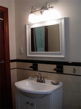 12 Shore Garden Road Hull, MA 02045 - Photo 8 of 22 a bathroom with a sink and a mirror