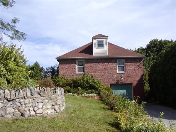 12 Shore Garden Road Hull, MA 02045 - Photo 10 of 22 a front view of a house with a yard