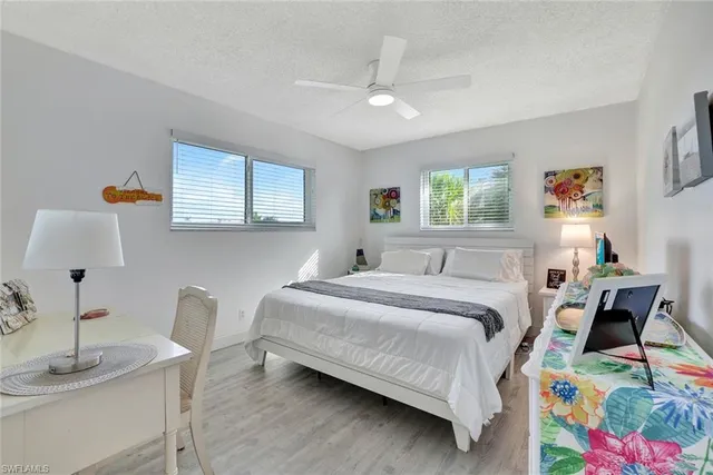 a bedroom with a bed and a table in it