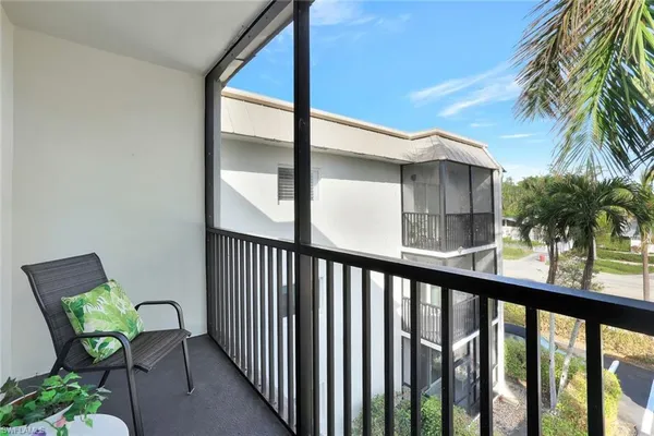 a view of balcony with furniture