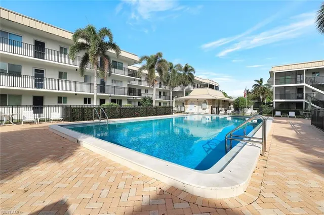 a view of a swimming pool with a lounge chairs