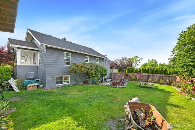 a view of a house with a backyard porch and sitting area