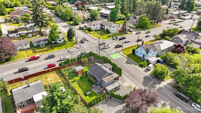 an aerial view of a house with a yard