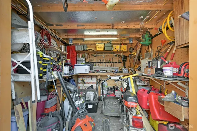 a view of walk in closet with clothes