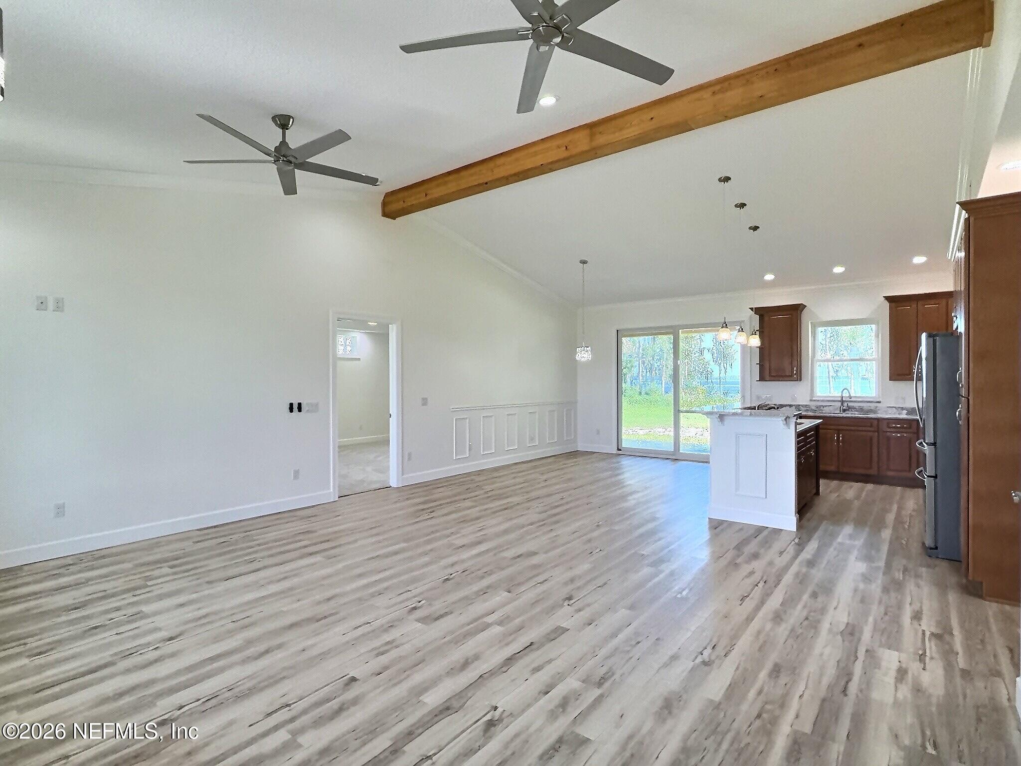 159 Mays Cove Road East Palatka, FL 32131 - Photo 16 of 62 a view of a living room a wooden floor and a window
