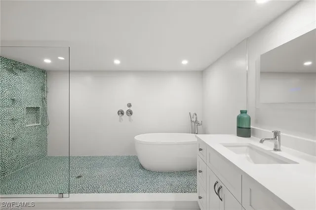 a bathroom with a shower a toilet and sink