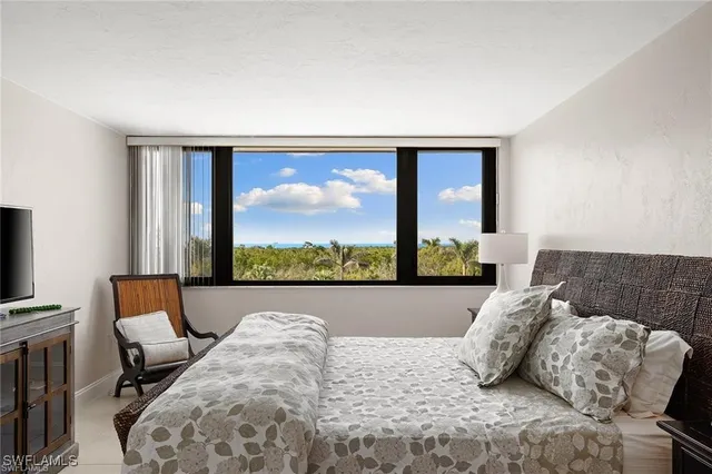 a bathroom with a double vanity sink and shower