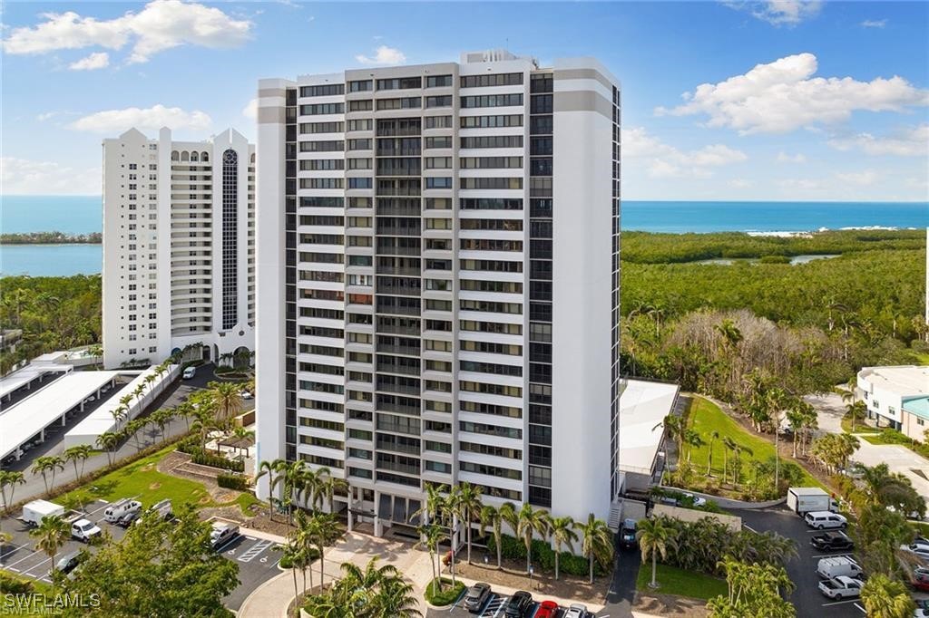 5601 Turtle Bay Drive, Unit 302 Naples, FL 34108 - Photo 4 of 44 a view of a city with tall buildings