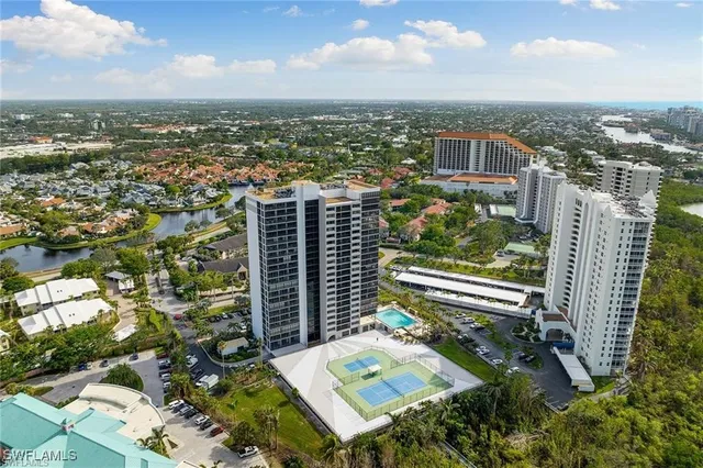 an aerial view of city and lake