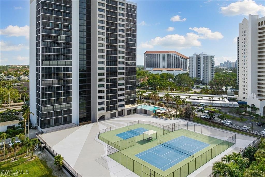 5601 Turtle Bay Drive, Unit 302 Naples, FL 34108 - Photo 44 of 44 a view of a swimming pool with chairs