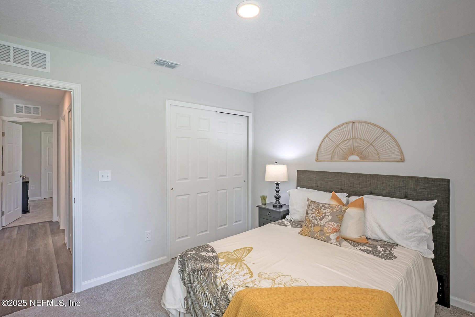 8768 Orme Road Jacksonville, FL 32220 - Photo 11 of 36 a bedroom with a bed and a mirror
